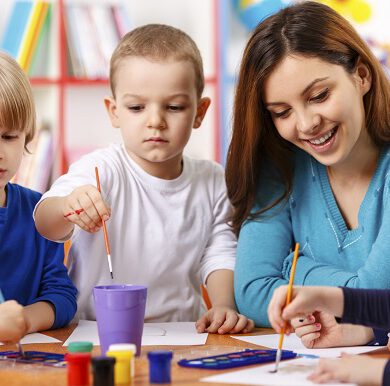 Group Of Elementary Age Children In Art Class With Teacher